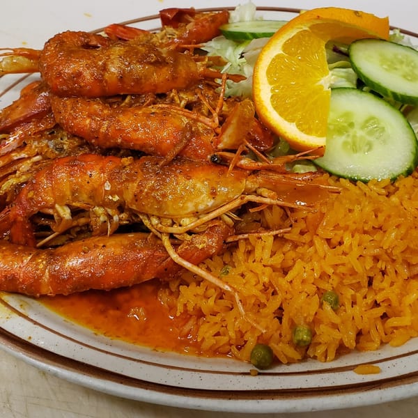 Los Amigos' Camarones a la Diabla, spicy shrimp with Mexican rice, lettuce, cucumber, and orange.